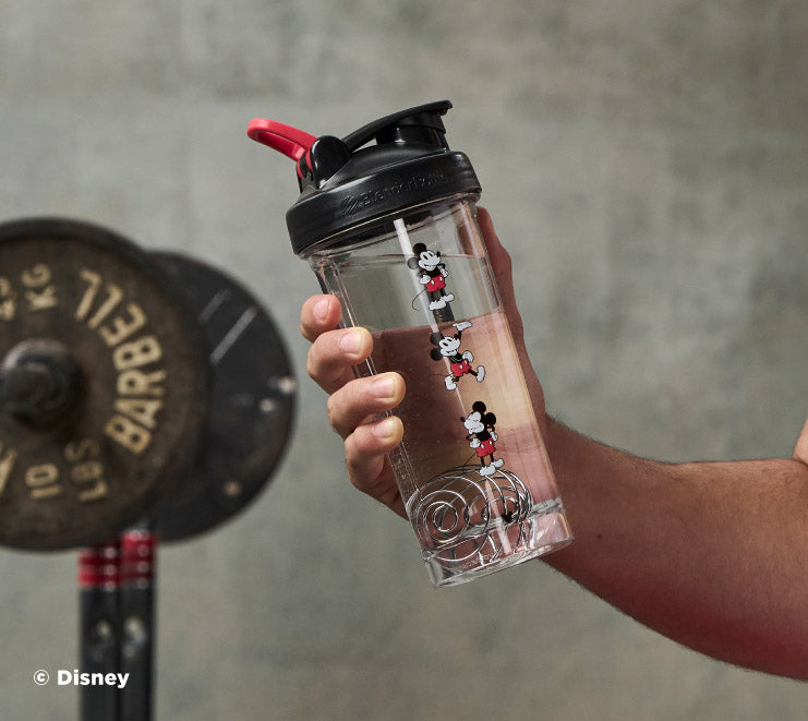 pro-series-u7 Mickey_Mouse_Protein_Shaker_Bottle_Being_Held_In_the_Gym.jpg